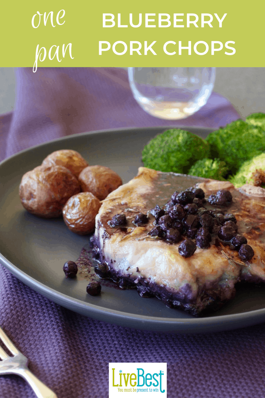 plate with blueberry topped pork chop, broccoli and potatoes